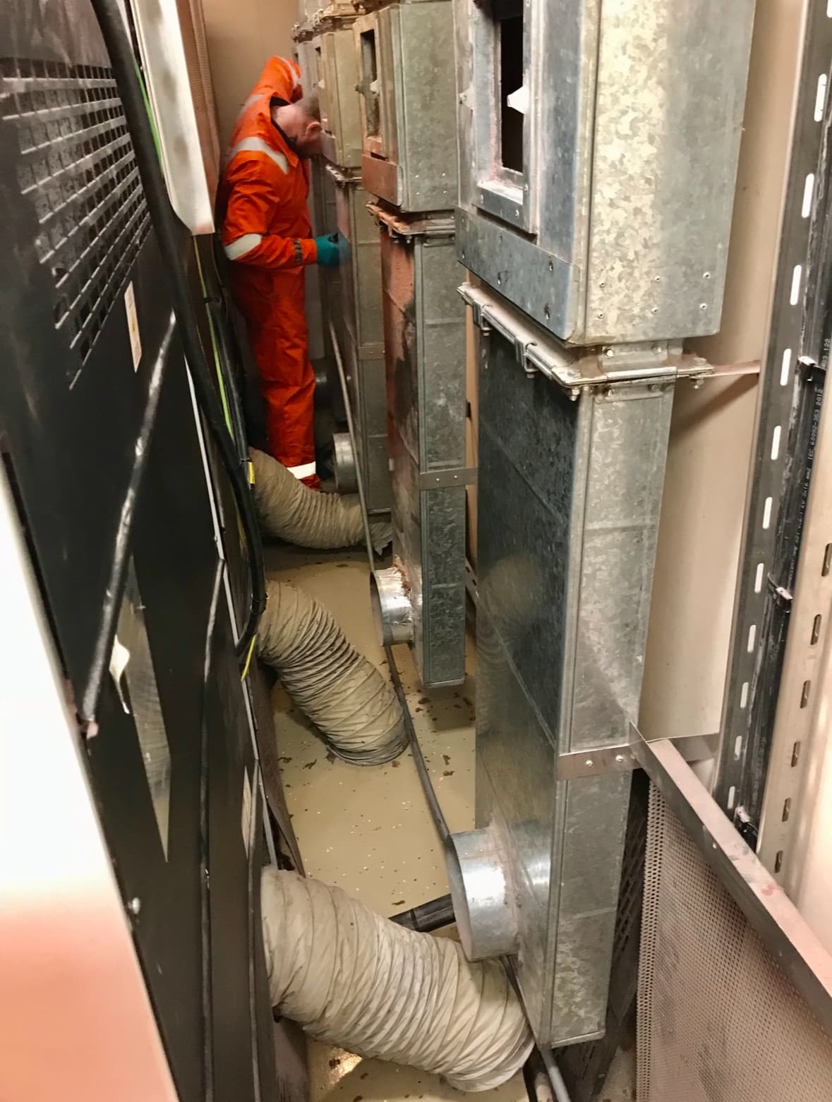 Deduct Ltd engineer cleaning ventilation ductwork in a vessel plant space
