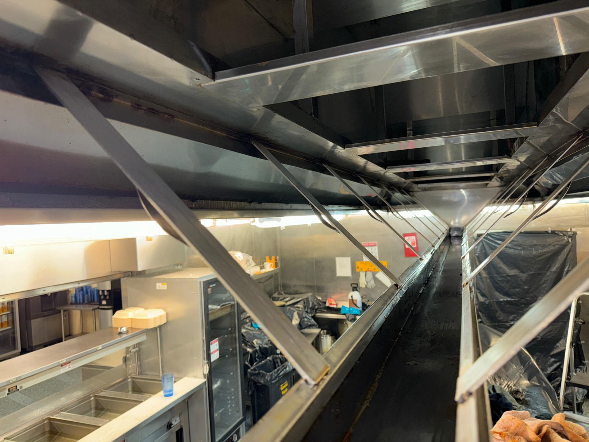 Commercial kitchen extract canopy in a Manchester city centre venue after cleaning