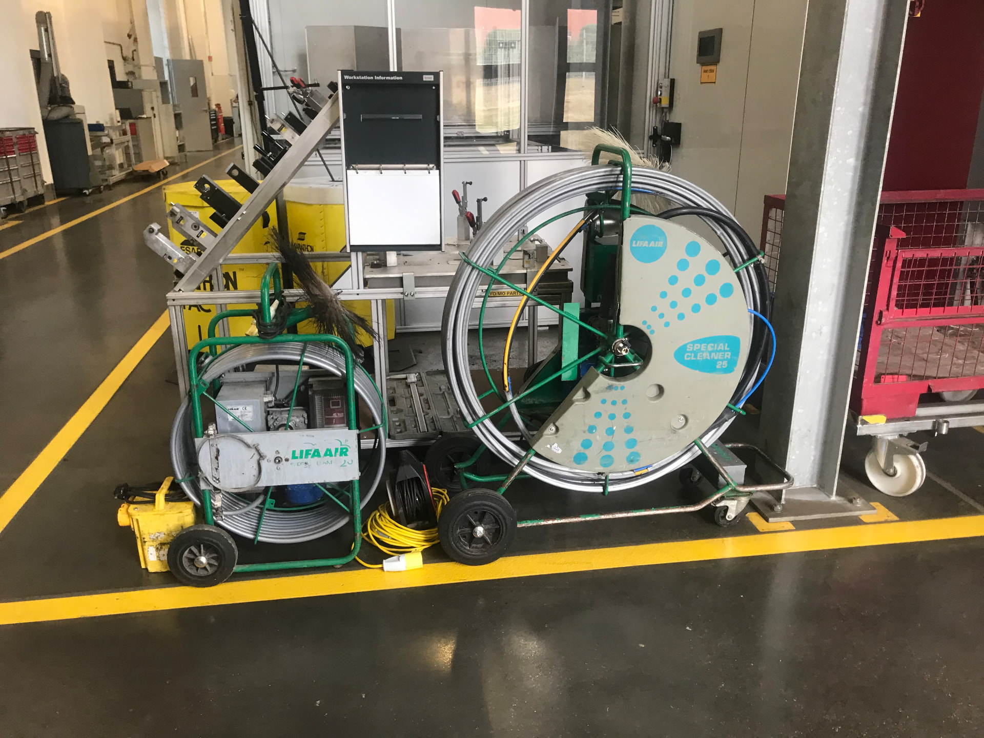 Ductwork cleaning equipment set up on a commercial site