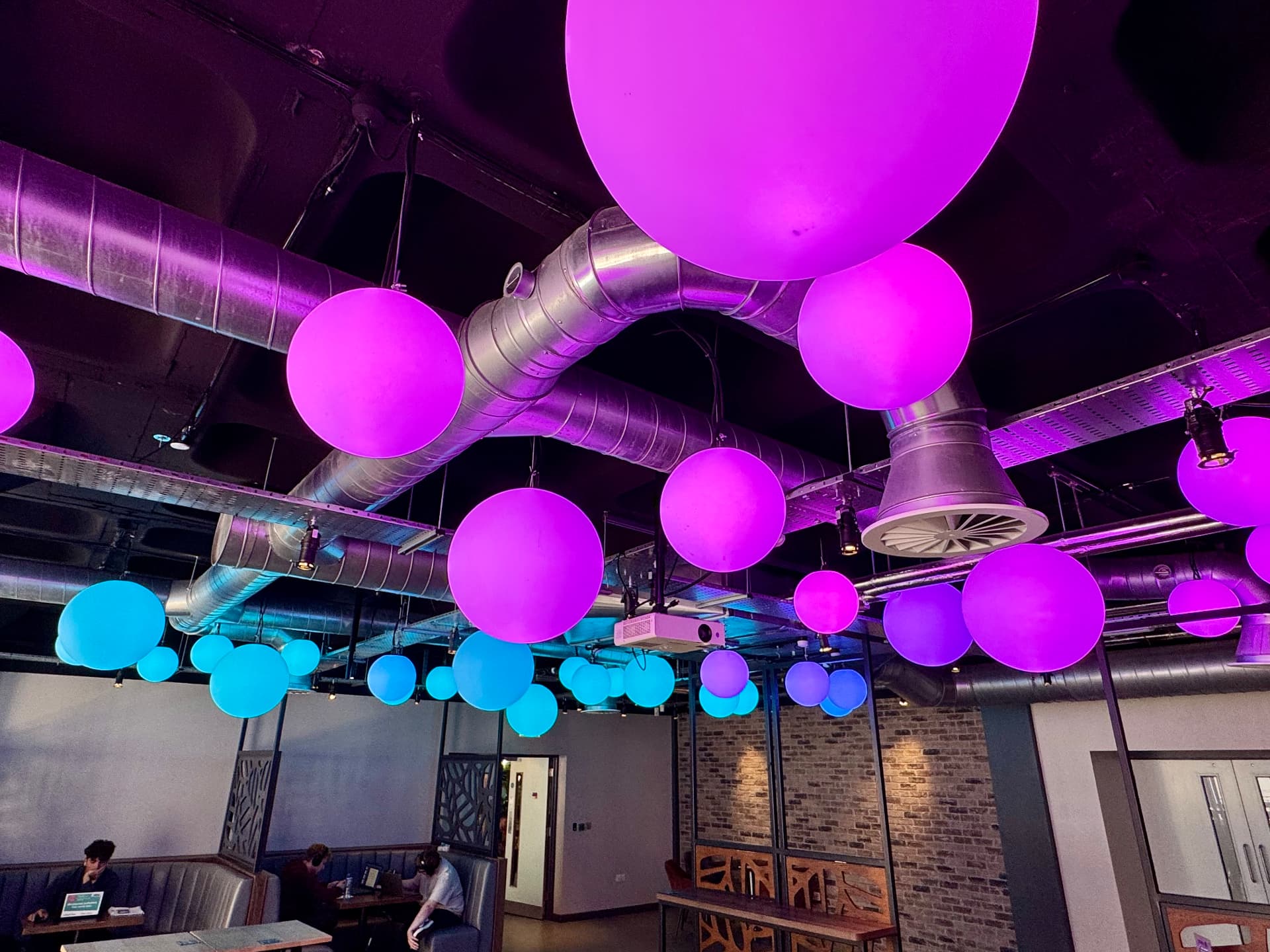 Feature ceiling ductwork and diffusers in a public leisure venue